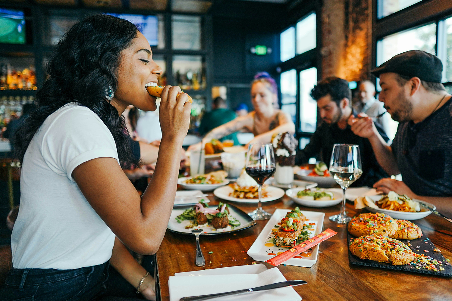 My Local Foodie About Page hero image of people enjoying eating food together